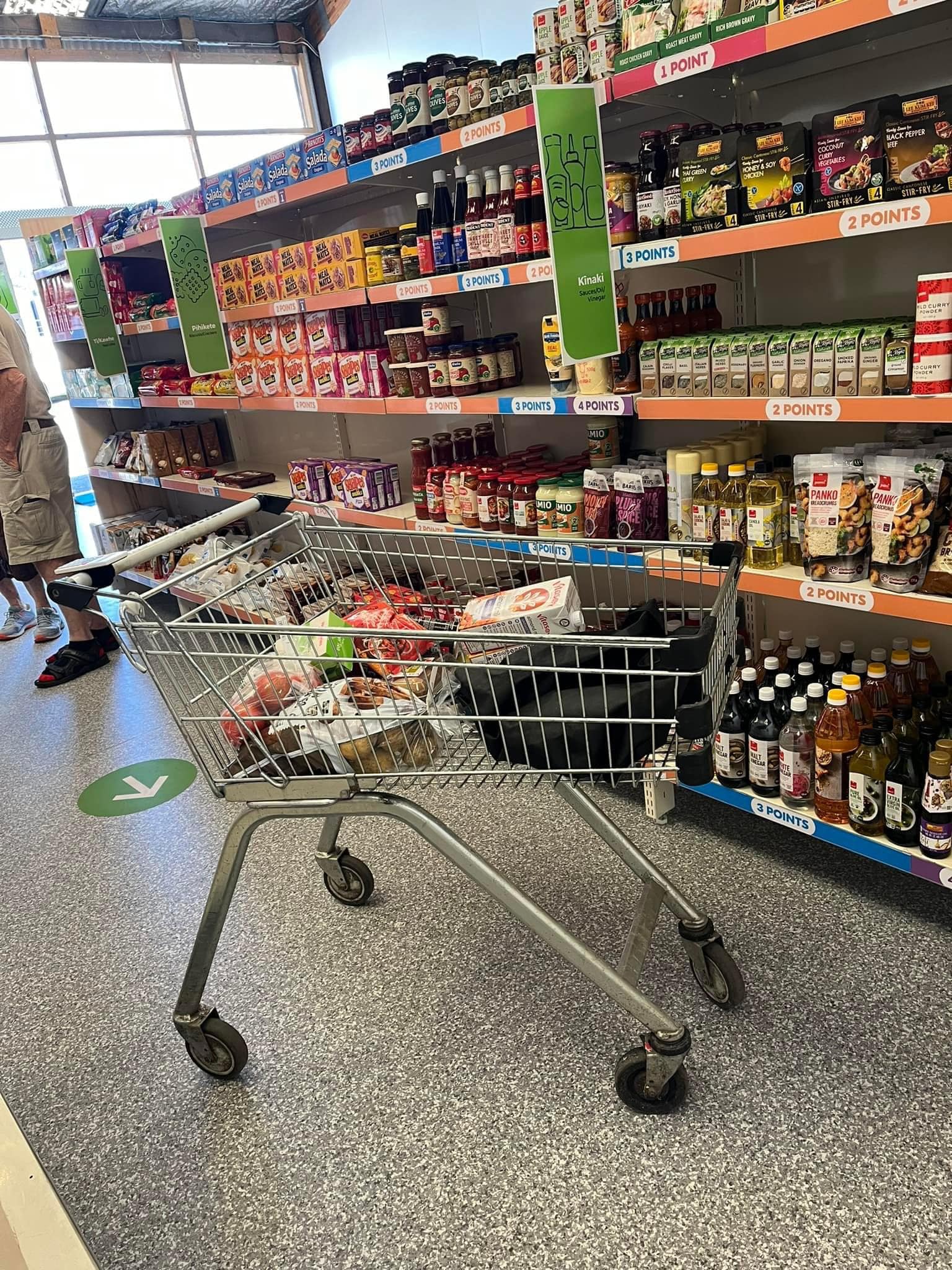 What you can buy at Pātaka Kai Hauraki Social Supermarket- A Shelf of stocked shopping trolley Hauraki refuge